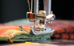 Why does my sewing machine needle hit the plate