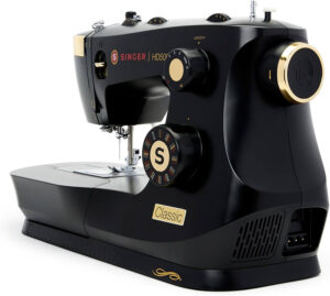 Sewing machine mechanic reviewing best sewing machines between $300 and $500 on a workbench